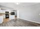 Open-concept living room with kitchen view and modern finishes at 2608 W Fletcher Ave, Tampa, FL 33618