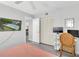 Comfortable bedroom with television, ceiling fan, desk and a closet at 3590 Magnolia Ridge Cir # 1103-C, Palm Harbor, FL 34684