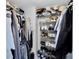 Walk-in closet with wire shelving and clothing at 3590 Magnolia Ridge Cir # 1103-C, Palm Harbor, FL 34684