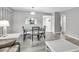 Bright dining space with sleek furniture, stylish lighting, and an open feel at 3590 Magnolia Ridge Cir # 1103-C, Palm Harbor, FL 34684