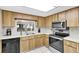 Well-equipped kitchen with updated appliances and generous counter space at 3590 Magnolia Ridge Cir # 1103-C, Palm Harbor, FL 34684