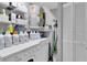 Efficient laundry room with ample storage space, shelving, and washer/dryer at 3590 Magnolia Ridge Cir # 1103-C, Palm Harbor, FL 34684