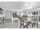 Spacious living room with updated floors, lots of light, and modern decor at 3590 Magnolia Ridge Cir # 1103-C, Palm Harbor, FL 34684