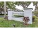 Magnolia Ridge community sign with beautiful landscaping and community branding at 3590 Magnolia Ridge Cir # 1103-C, Palm Harbor, FL 34684