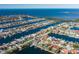 Waterfront home boasts a private dock, screened lanai, and pool overlooking scenic canals leading to the open ocean at 3616 Harborview Ct, New Port Richey, FL 34652
