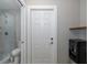 Bathroom with mosaic tile shower and toilet is conveniently located next to the water cooler at 3616 Harborview Ct, New Port Richey, FL 34652