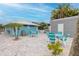 Outdoor seating at Gulf Harbors Beach Club offers shaded tables, ideal for relaxing and enjoying the beach atmosphere at 3616 Harborview Ct, New Port Richey, FL 34652