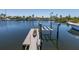 Private dock with boat lift, offering convenient access to water activities with adjacent boat parking at 3616 Harborview Ct, New Port Richey, FL 34652