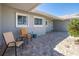 Relaxing front patio with comfortable seating, complemented by a nicely paved entrance and cozy home facade at 3616 Harborview Ct, New Port Richey, FL 34652