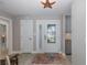 Inviting foyer featuring a decorative front door, stylish flooring, and a striking starfish light fixture at 3616 Harborview Ct, New Port Richey, FL 34652