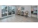 Bright sitting area features sliding glass doors with backyard views, and comfortable seating at 3616 Harborview Ct, New Port Richey, FL 34652