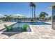 Sparkling pool with chairs and clear blue water surrounded by a beautifully paved patio at 3616 Harborview Ct, New Port Richey, FL 34652