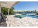 Backyard pool overlooking the water and dock with plenty of room for entertaining and relaxing at 3616 Harborview Ct, New Port Richey, FL 34652