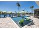 Backyard swimming pool with chairs overlooking the water and boat dock at 3616 Harborview Ct, New Port Richey, FL 34652