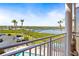 Balcony view showing a canal, bridge and swimming pool at 4516 Seagull Dr # 408, New Port Richey, FL 34652