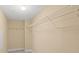 Walk-in closet with custom shelving and neutral paint, with carpet flooring at 4516 Seagull Dr # 408, New Port Richey, FL 34652