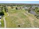 Aerial view of community soccer fields, pond, baseball field, playground, pool, and tennis courts at 4817 Glenaire Ct, Tampa, FL 33624