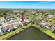 Aerial view of a home with a pond, showcasing the neighborhood and the surrounding lush landscape at 4817 Glenaire Ct, Tampa, FL 33624