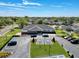 Aerial view of a community clubhouse and well-maintained landscaping on a sunny day at 4817 Glenaire Ct, Tampa, FL 33624