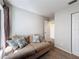 Living room featuring neutral walls, carpet, a sofa, and a window, creating a comfortable space at 4817 Glenaire Ct, Tampa, FL 33624