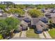 Charming townhomes with attached garages nestled among mature trees in a well-maintained community with a pool at 6518 Remus Dr, New Port Richey, FL 34653