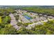 Beautiful townhome community surrounded by lush trees, centered around a tranquil pond and fountain at 6518 Remus Dr, New Port Richey, FL 34653