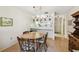 Dining area with hardwood floors and a wooden dining set, conveniently located near the kitchen at 6518 Remus Dr, New Port Richey, FL 34653