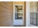 Inviting entryway with a screen door, natural light, and a glimpse of the neighborhood beyond at 6518 Remus Dr, New Port Richey, FL 34653
