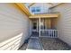 Inviting entryway with a charming front porch featuring comfortable seating and natural light at 6518 Remus Dr, New Port Richey, FL 34653