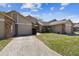 Charming townhome featuring a two-car garage, well-maintained lawn, and inviting curb appeal at 6518 Remus Dr, New Port Richey, FL 34653