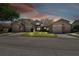 Dusk view showcasing well-maintained two-story homes with garages, illuminated by soft lighting at 6518 Remus Dr, New Port Richey, FL 34653