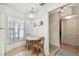 Bright kitchen nook with a breakfast table, large window, and convenient access to storage at 6518 Remus Dr, New Port Richey, FL 34653