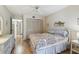 Comfortable main bedroom features a ceiling fan, closet with wood doors, and interior access at 6518 Remus Dr, New Port Richey, FL 34653