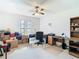 Bedroom featuring a ceiling fan, neutral walls, and natural light from two windows at 6822 Eastbrook Dr, Spring Hill, FL 34606