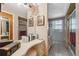 A functional bathroom boasting ample counter space, decorative mirrors, and a separate vanity area at 7514 Bergamot Dr, Port Richey, FL 34668
