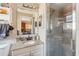 Bathroom featuring a shower, granite countertops and lots of natural light at 7514 Bergamot Dr, Port Richey, FL 34668