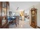Cozy dining area featuring tile floors and a decorative grandfather clock at 7514 Bergamot Dr, Port Richey, FL 34668