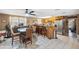 Kitchen with eat-in dining area, granite countertops, stainless steel appliances and tile floors at 7514 Bergamot Dr, Port Richey, FL 34668