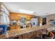 Kitchen featuring wooden cabinets, stainless steel appliances, and granite countertops at 7514 Bergamot Dr, Port Richey, FL 34668