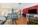 Spacious living room with hardwood floors, and a decorative fireplace at 7514 Bergamot Dr, Port Richey, FL 34668