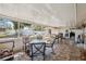 An enclosed patio with a dining area, ceiling, and plenty of space for entertaining at 7514 Bergamot Dr, Port Richey, FL 34668