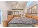 Bright bedroom with a ceiling fan, complemented by a wooden dresser and hints of tasteful decor at 9131 Rhett Ln, Weeki Wachee, FL 34613