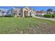 Exterior of a one-story home featuring a well-manicured lawn and tidy landscaping at 9131 Rhett Ln, Weeki Wachee, FL 34613