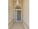 Inviting front porch with a decorative security door, creating a warm and welcoming entrance at 9131 Rhett Ln, Weeki Wachee, FL 34613