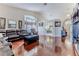 Spacious living room featuring high ceilings, gleaming hardwood floors, and lots of natural light at 9131 Rhett Ln, Weeki Wachee, FL 34613