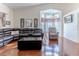 Bright living room boasts large windows, hardwood floors, and a cozy seating area at 9131 Rhett Ln, Weeki Wachee, FL 34613