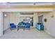 Relaxing covered patio with a ceiling fan, complemented by comfortable furniture, creating an inviting outdoor escape at 9131 Rhett Ln, Weeki Wachee, FL 34613