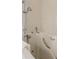 Relaxing walk-in tub with safety features and a handheld shower, creating a spa-like experience at home at 9131 Rhett Ln, Weeki Wachee, FL 34613