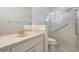 Modern bathroom featuring a sleek vanity and a glass-enclosed shower at 9144 Bassett Ln, New Port Richey, FL 34655