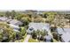 Inviting home featuring well-maintained landscaping, dual garages and a charming architectural design at 9144 Bassett Ln, New Port Richey, FL 34655